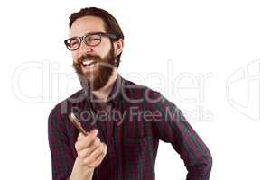 Handsome hipster laughing and pointing
