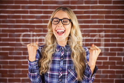 Gorgeous blonde hipster celebrating success