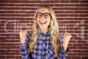 Gorgeous blonde hipster celebrating success