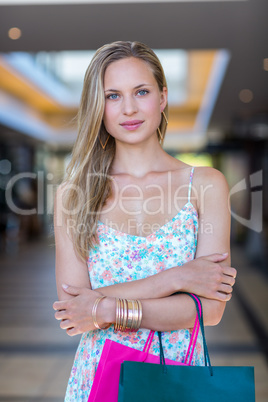 Portrait of smiling woman with arms crossed