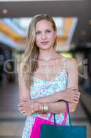 Portrait of smiling woman with arms crossed