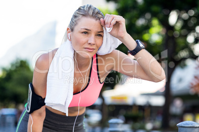 A beautiful athlete resting with a towel