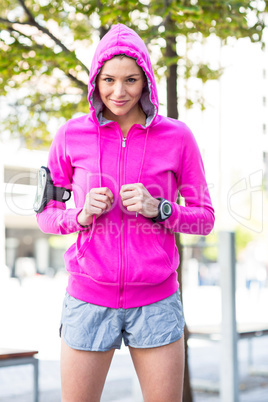 A woman wearing a pink jacket