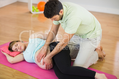 Pregnant woman getting massage for pregnant belly