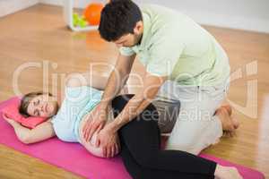 Pregnant woman getting massage for pregnant belly