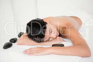 Woman having a massage with stones
