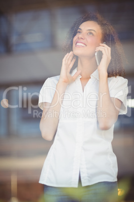 Smiling woman talking on the phone