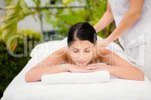 Attractive woman receiving back massage