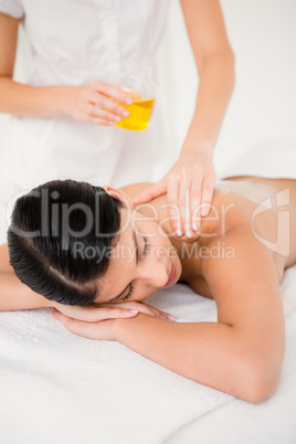 Beautiful woman enjoying oil massage