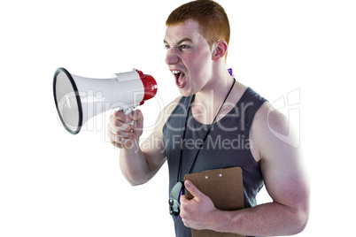 Angry personal trainer yelling through megaphone