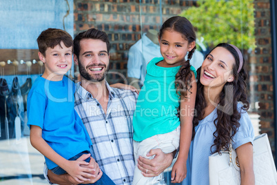 Happy family having fun in the mall