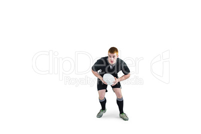 Rugby player running with a rugby ball
