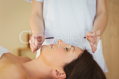 Young woman having a reiki treatment