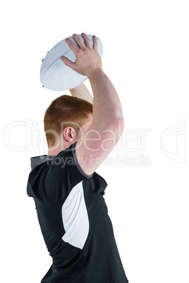 Rugby player about to throw a rugby ball