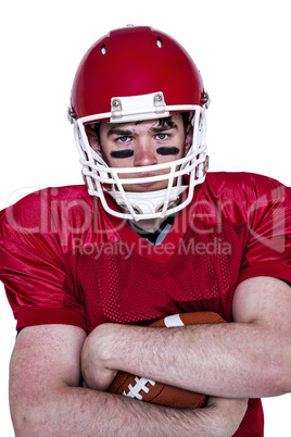 American football player with arms crossed