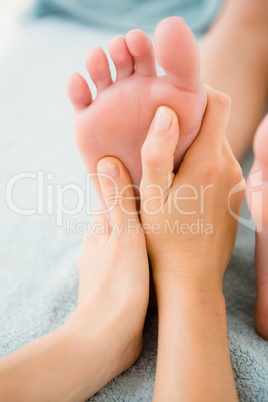 Close-up of a woman receiving foot massage