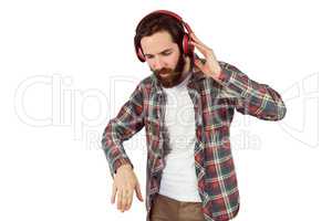 Handsome hipster enjoying listening to music