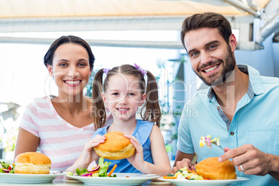Portrait of a family eating at the restaurant