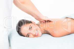 Pretty brunette enjoying a massage