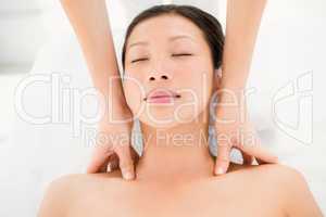 Attractive young woman receiving shoulder massage