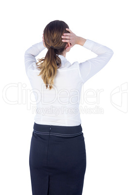 Stressed businesswoman with hands on her head