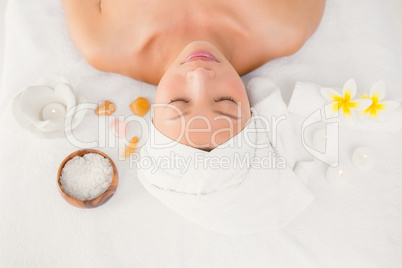 Relaxed woman lying on the massage table