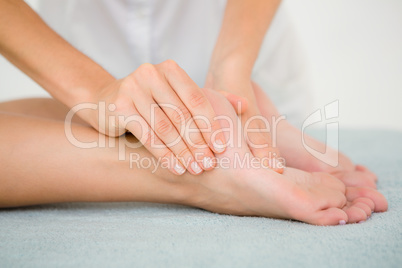 Close-up of a woman receiving foot massage