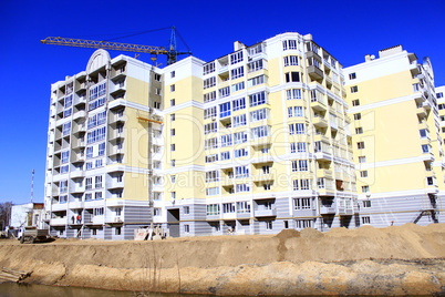 construction of modern house with hoisting crane