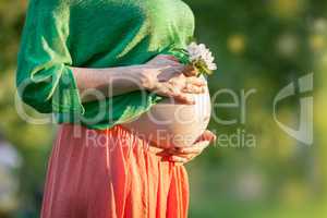 Bare Pregnant Belly with Flower