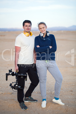 Young people with steadycam on the beach