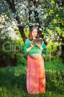 She having peaceful time with pad outdoor