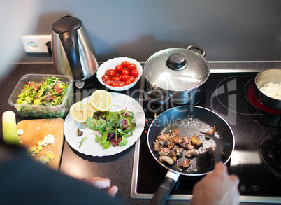 Cooking tasty family dinner at home