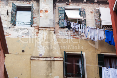 Old grungy building with linen outside