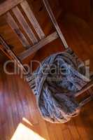 Woollen scarf lying on wooden chair