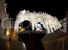 Tourist with pad shooting St. Peters Basilica in Vatican City