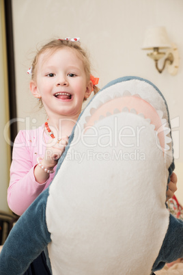 Girl Playing with Plush Toy