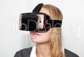 Woman wearing VR-headset over white background