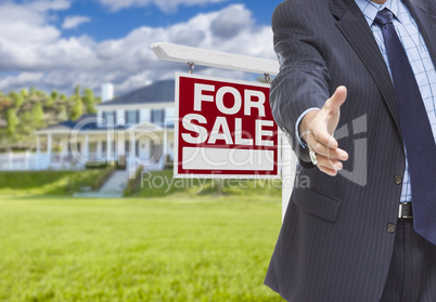 Agent Reaches for Handshake, Sale Sign and House Behind