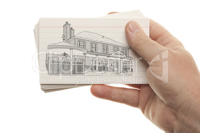 Male Hand Holding Stack of Flash Cards with House Drawing