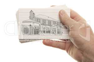 Male Hand Holding Stack of Flash Cards with House Drawing