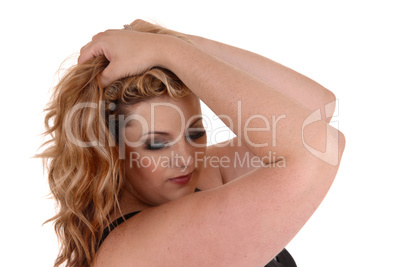 Woman with her hands on head.