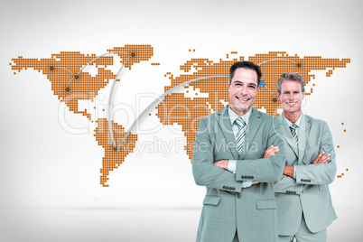Composite image of  business team standing arms crossed