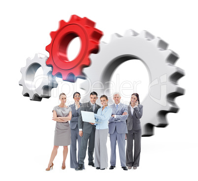 Composite image of business team looking at camera