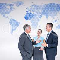 Composite image of business people standing and talking