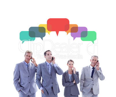Composite image of employees using their mobile phone