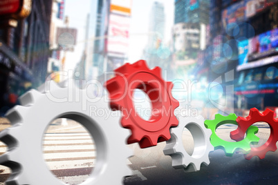 Composite image of white and red cogs and wheels