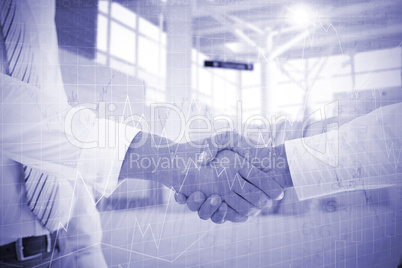 Composite image of close-up shot of a handshake in office