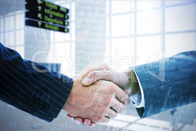 Composite image of business people shaking hands