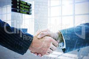 Composite image of business people shaking hands