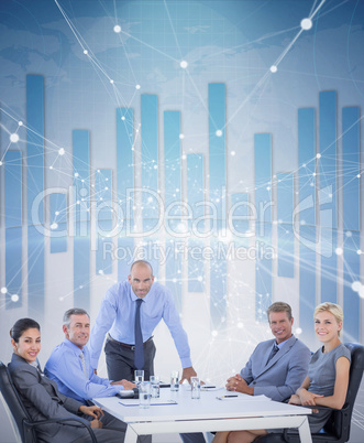 Composite image of happy business people looking at camera